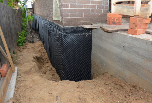 Happy homeowners after waterproofing job in Crystal